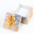 Square multicoloured box with bow for ring
